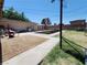 Spacious backyard with a pool, grass area, and a covered patio area at 109 Prince Ln, Las Vegas, NV 89110