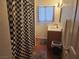 Full bathroom with tiled shower and checkered shower curtain at 109 Prince Ln, Las Vegas, NV 89110