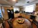 Functional kitchen with natural wood cabinets, granite countertops, and ample counter space at 109 Prince Ln, Las Vegas, NV 89110