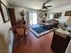 Cozy living area with tile floors, ceiling fan, and sliding glass doors with lots of natural light at 109 Prince Ln, Las Vegas, NV 89110