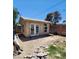 View of detached outbuilding featuring double french doors and an arched window at 109 Prince Ln, Las Vegas, NV 89110