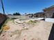 Backyard swimming pool in need of maintenance surrounded by a spacious yard at 109 Prince Ln, Las Vegas, NV 89110