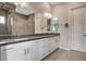 Double vanity bathroom features quartz countertops and tiled floors at 10985 Limeslice Ave # 2, Las Vegas, NV 89135