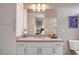 Bathroom featuring double sinks, quartz countertop and an open view of the bedroom at 10985 Limeslice Ave # 2, Las Vegas, NV 89135