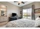 This neutral main bedroom features an ensuite bathroom and large window with a nice view at 10985 Limeslice Ave # 2, Las Vegas, NV 89135