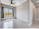 Bedroom featuring modern ceiling fan, tile flooring and lots of natural light at 10985 Limeslice Ave # 2, Las Vegas, NV 89135