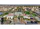 Community clubhouse surrounded by lush landscaping, green spaces, and ample parking at 10985 Limeslice Ave # 2, Las Vegas, NV 89135