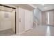 Foyer featuring a modern elevator, tile flooring, and easy access to the home's entry at 10985 Limeslice Ave # 2, Las Vegas, NV 89135
