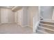 Inviting foyer with tile flooring, staircase, and convenient access to multiple doors at 10985 Limeslice Ave # 2, Las Vegas, NV 89135