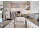 Modern kitchen featuring stainless steel appliances, granite countertops, and sleek white cabinetry at 10985 Limeslice Ave # 2, Las Vegas, NV 89135