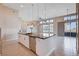 Open concept kitchen features a large island with granite countertops and stainless steel appliances at 10985 Limeslice Ave # 2, Las Vegas, NV 89135