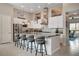 Contemporary kitchen with bar seating, stainless steel appliances, and modern pendant lighting at 10985 Limeslice Ave # 2, Las Vegas, NV 89135