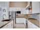 Modern kitchen with sleek stainless steel appliances and granite countertops at 10985 Limeslice Ave # 2, Las Vegas, NV 89135