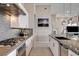 Well-equipped kitchen with a gas cooktop, modern backsplash, and an open layout design at 10985 Limeslice Ave # 2, Las Vegas, NV 89135