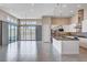 Open-concept kitchen and living area with a spacious layout and modern appliances at 10985 Limeslice Ave # 2, Las Vegas, NV 89135