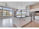 Modern kitchen featuring a large island, stainless steel appliances, and ample natural light at 10985 Limeslice Ave # 2, Las Vegas, NV 89135