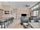Open-concept living space with modern furnishings and a connected kitchen featuring a large island at 10985 Limeslice Ave # 2, Las Vegas, NV 89135