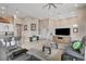 Modern living area with a comfortable sofa, flat-screen TV, and adjoining kitchen bar seating at 10985 Limeslice Ave # 2, Las Vegas, NV 89135