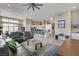 Open-concept living space with a sleek kitchen, comfortable seating, and ample natural light at 10985 Limeslice Ave # 2, Las Vegas, NV 89135