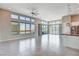 Open-concept living area with tiled floor and large windows offering plenty of natural light at 10985 Limeslice Ave # 2, Las Vegas, NV 89135