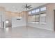 Bright living room features soaring ceilings, recessed lights, fan, and large windows with views at 10985 Limeslice Ave # 2, Las Vegas, NV 89135