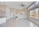 Bright, open-concept living area featuring high ceilings and multiple windows at 10985 Limeslice Ave # 2, Las Vegas, NV 89135