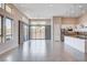 Bright living space with large windows and sliding glass doors, seamlessly blending indoor and outdoor living at 10985 Limeslice Ave # 2, Las Vegas, NV 89135