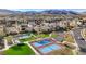 Aerial view of tennis courts and landscaped areas within a modern residential community at 10985 Limeslice Ave # 2, Las Vegas, NV 89135