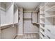 Well-organized walk-in closet featuring custom shelving, hanging rods, and ample storage space at 10985 Limeslice Ave # 2, Las Vegas, NV 89135