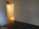 A carpeted bedroom featuring neutral walls and doorway to the bathroom at 1105 Sulphur Springs Ln # 102, Las Vegas, NV 89128
