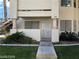 Charming condo with desert landscaping, private entrance, and convenient access to upper-level units via exterior stairs at 1105 Sulphur Springs Ln # 102, Las Vegas, NV 89128