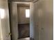 Hallway with closet leading to a bedroom with a window at 1105 Sulphur Springs Ln # 102, Las Vegas, NV 89128