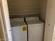 A laundry closet includes a washing machine and a dryer at 1105 Sulphur Springs Ln # 102, Las Vegas, NV 89128
