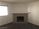Cozy living room highlighting a charming brick fireplace, neutral walls, and a well-lit ambiance at 1105 Sulphur Springs Ln # 102, Las Vegas, NV 89128