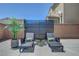 Backyard lounge area with modern privacy screen and lush landscaping at 1321 Hudson Creek Pl, North Las Vegas, NV 89084