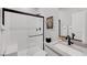 Modern bathroom with a walk-in shower, black hardware, and elegant fixtures for a spa-like experience at 1321 Hudson Creek Pl, North Las Vegas, NV 89084