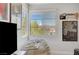 Cozy bedroom featuring a large window with views and a comfy beanbag chair at 1321 Hudson Creek Pl, North Las Vegas, NV 89084