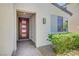 Inviting front entrance with stylish, modern door, brick walkway, and tasteful landscaping at 1321 Hudson Creek Pl, North Las Vegas, NV 89084