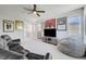 Spacious upstairs game room with neutral carpet and a comfortable black leather sectional for movie viewing at 1321 Hudson Creek Pl, North Las Vegas, NV 89084