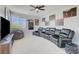 Upstairs game room with a ceiling fan, and a large sectional for plenty of comfortable seating at 1321 Hudson Creek Pl, North Las Vegas, NV 89084