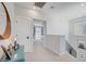 Bright hallway with modern lighting fixtures leading to a bedroom showcasing an inviting and open floor plan at 1321 Hudson Creek Pl, North Las Vegas, NV 89084