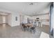 Bright, open-concept kitchen boasts white cabinetry, stainless appliances, and a large center island with barstool seating at 1321 Hudson Creek Pl, North Las Vegas, NV 89084
