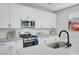 Bright kitchen with stainless steel appliances, sleek countertops, and a modern design at 1321 Hudson Creek Pl, North Las Vegas, NV 89084