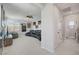 Spacious living room featuring a large sofa, media center, and abundant natural light from the windows at 1321 Hudson Creek Pl, North Las Vegas, NV 89084