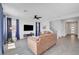Open living room view, with tile flooring, staircase, neutral paint and ceiling fan at 1321 Hudson Creek Pl, North Las Vegas, NV 89084