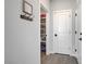 Pantry showing shelving space for storage with the door ajar at 1321 Hudson Creek Pl, North Las Vegas, NV 89084