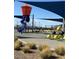 A vibrant community playground featuring slides, climbing structures, and shaded areas at 1321 Hudson Creek Pl, North Las Vegas, NV 89084