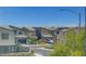 View of a modern home and street in a residential neighborhood at 1321 Hudson Creek Pl, North Las Vegas, NV 89084