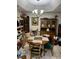 Dining room with round wooden table and chairs, surrounded by china cabinets at 1407 Santa Margarita St # A, Las Vegas, NV 89146