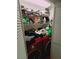 Convenient laundry closet with red washer and dryer and plenty of shelving for storage at 1407 Santa Margarita St # A, Las Vegas, NV 89146